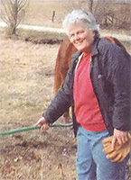 Place a section of garden hose over the wire when you need to pass safely across an active electric fence.